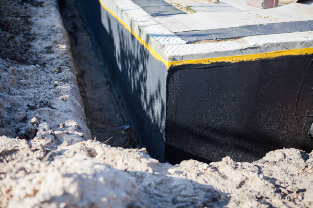 Professional Emergency Waterproofing technician working in Oswego, NY